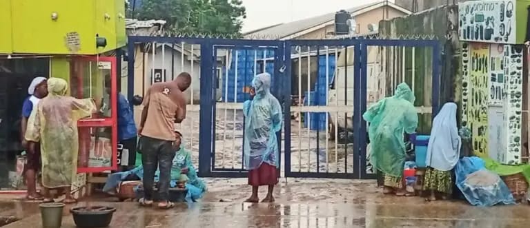 LAGOS RESIDENTS EMBRACE NYLON RAINCOATS AS HEAVY RAINS, RISING COSTS&nbsp;BITE